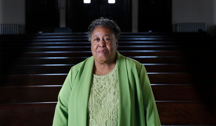 FILE - Clara Ester stands in the Centenary United Methodist Church in Memphis, Tenn., on March 17, 2018. (AP Photo/Mark Humphrey, File)