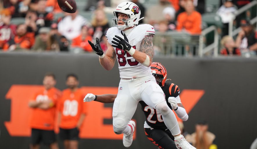 FILE - Arizona Cardinals tight end Trey McBride (85) catches a touchdown pass in the end zone during the second half of an NFL football game against the Cincinnati Bengals, Dec. 28, 2025, in Cincinnati. (AP Photo/Joshua A. Bickel, File)