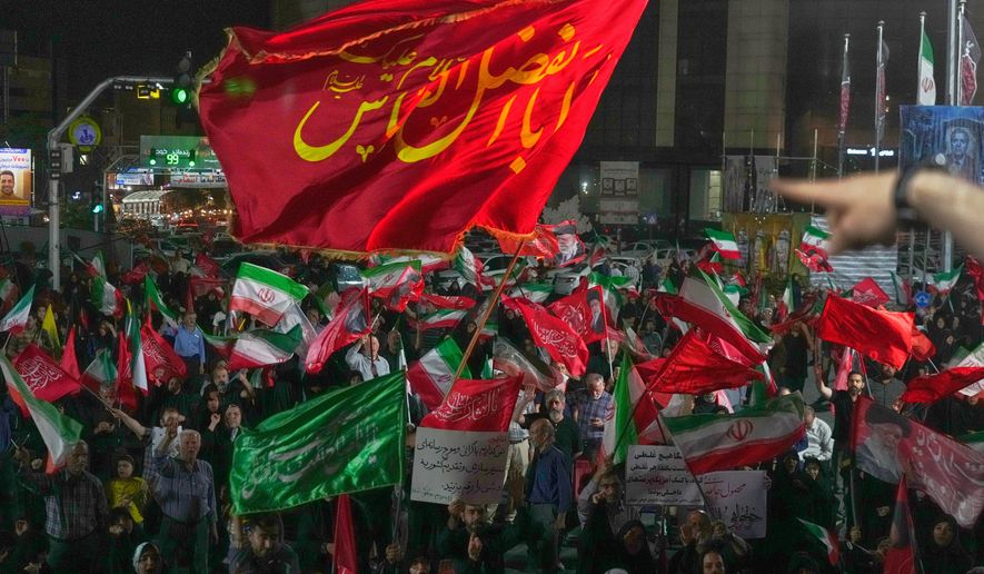 Pro-government demonstrators gather at a square in Tehran, Friday, July 17, 2026. (AP Photo/Vahid Salemi)