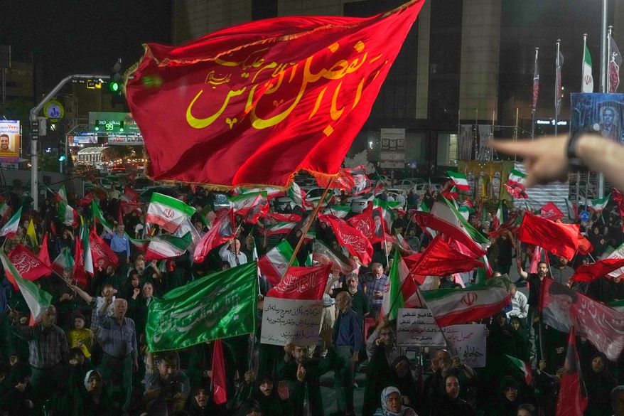 Pro-government demonstrators gather at a square in Tehran, Friday, July 17, 2026. (AP Photo/Vahid Salemi)