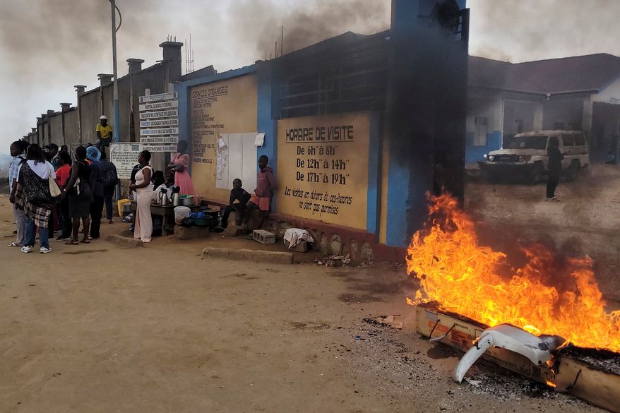 Rubble set on fire as health workers involved in Congo's Ebola response go on strike as they protest over payment issues in Bunia, Congo, Wednesday, July 15, 2026. (AP Photo/Constant Same Bagalwa)