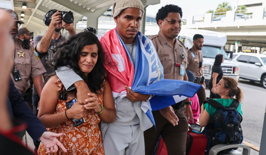 Cuban dissident artist Luis Manuel Otero Alcántara arrives at Miami International Airport on Saturday, July 18, 2026, after serving a five-year prison sentence in Cuba. (AP Photo/David Santiago)