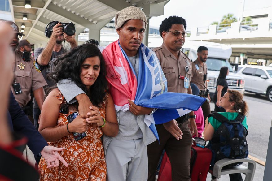 Cuban dissident artist Luis Manuel Otero Alcántara arrives at Miami International Airport on Saturday, July 18, 2026, after serving a five-year prison sentence in Cuba. (AP Photo/David Santiago)