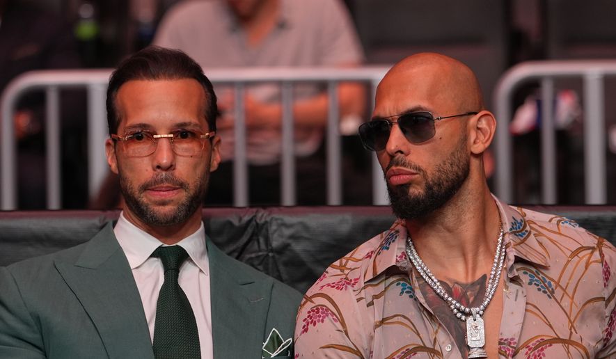 Andrew Tate, right, and his brother Tristan arrive at an event, April 11, 2026, in Miami. (AP Photo/Julia Demaree Nikhinson, Pool, File)