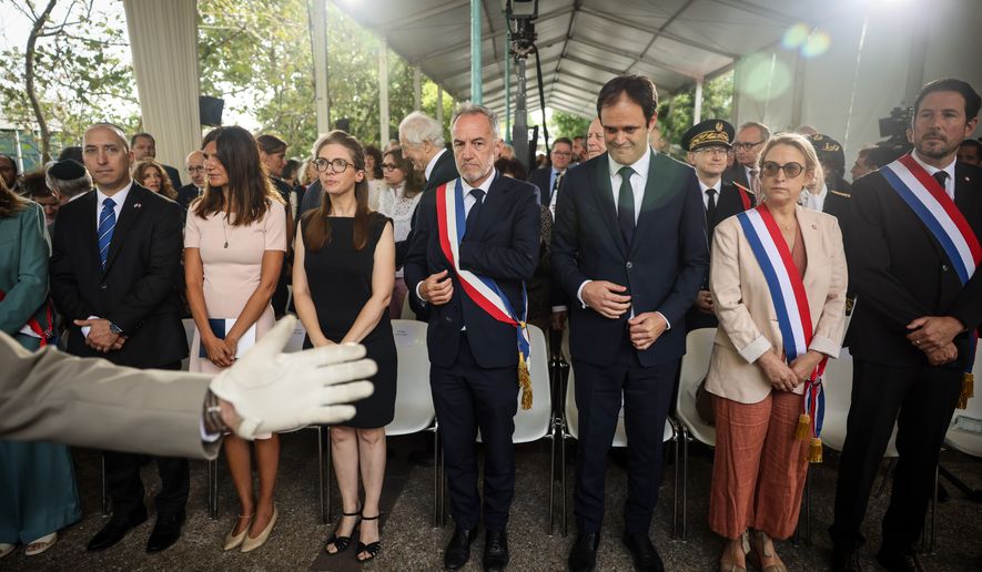 Alice Rufo, Minister Delegate to the Minister of the Armed Forces and Veterans, second left, Aurore Bergé, Minister Delegate for Equality between Women and Men and the Fight against Discrimination, third left, Emmanuel Gregoire Paris mayor, center, and Yonathan Arfi, President of CRIF (Representative Council of Jewish Institutions in France), third right, attend the ceremony marking the 84th anniversary of the 1942 Vel d'Hiv police roundup, the largest roundup of Jews in France during World War II, and paying tribute to the Righteous Among the Nations of France in Paris, Sunday, July 19, 2026. (AP Photo/Thomas Padilla)