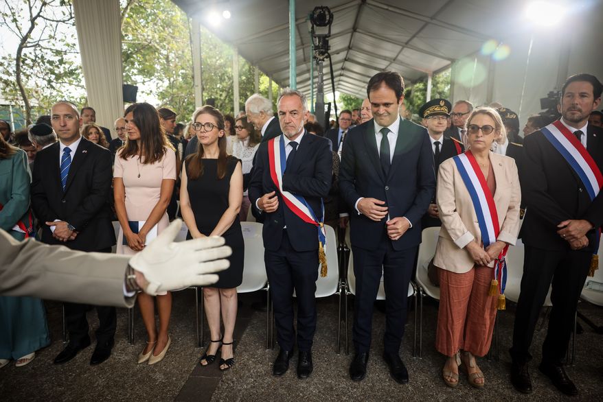 Alice Rufo, Minister Delegate to the Minister of the Armed Forces and Veterans, second left, Aurore Bergé, Minister Delegate for Equality between Women and Men and the Fight against Discrimination, third left, Emmanuel Gregoire Paris mayor, center, and Yonathan Arfi, President of CRIF (Representative Council of Jewish Institutions in France), third right, attend the ceremony marking the 84th anniversary of the 1942 Vel d'Hiv police roundup, the largest roundup of Jews in France during World War II, and paying tribute to the Righteous Among the Nations of France in Paris, Sunday, July 19, 2026. (AP Photo/Thomas Padilla)