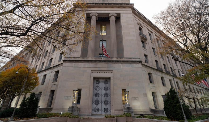 FILE - The U.S. Department of Justice building is seen in Washington, Saturday, Dec. 7, 2024. (AP Photo/Jose Luis Magana, File)