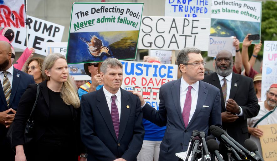 Former Olympic canoeist David Hearn, second from left, listens as his attorney Norman Eisen, right, speaks after he pleaded not guilty to allegedly damaging the Lincoln Memorial Reflecting Pool, Thursday, July 9, 2026, in Washington. (AP Photo/Rod Lamkey, Jr.)
