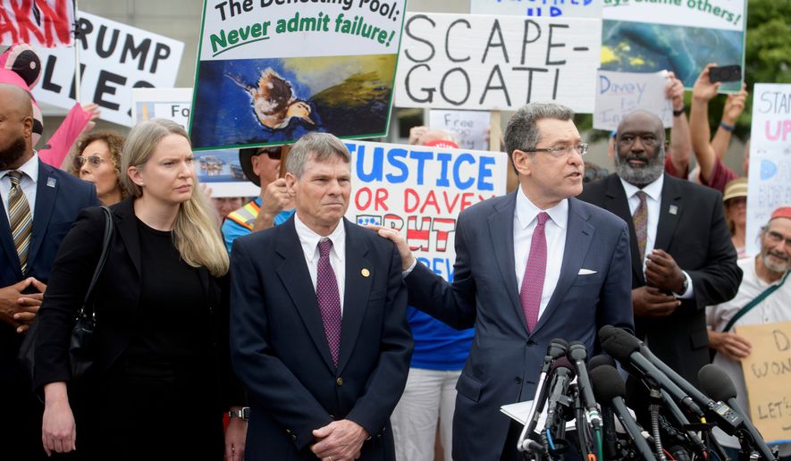 Former Olympic canoeist David Hearn, second from left, listens as his attorney Norman Eisen, right, speaks after he pleaded not guilty to allegedly damaging the Lincoln Memorial Reflecting Pool, Thursday, July 9, 2026, in Washington. (AP Photo/Rod Lamkey, Jr.)