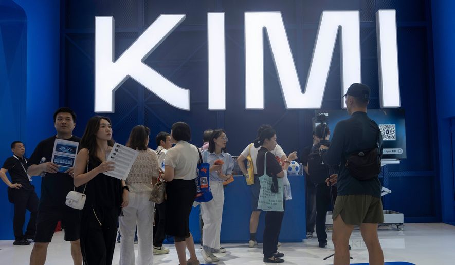 Visitors at the booth for Moonshot's Kimi K3 during the World Artificial Intelligence Conference in Shanghai, Friday, July 17, 2026. (AP Photo/Ng Han Guan)
