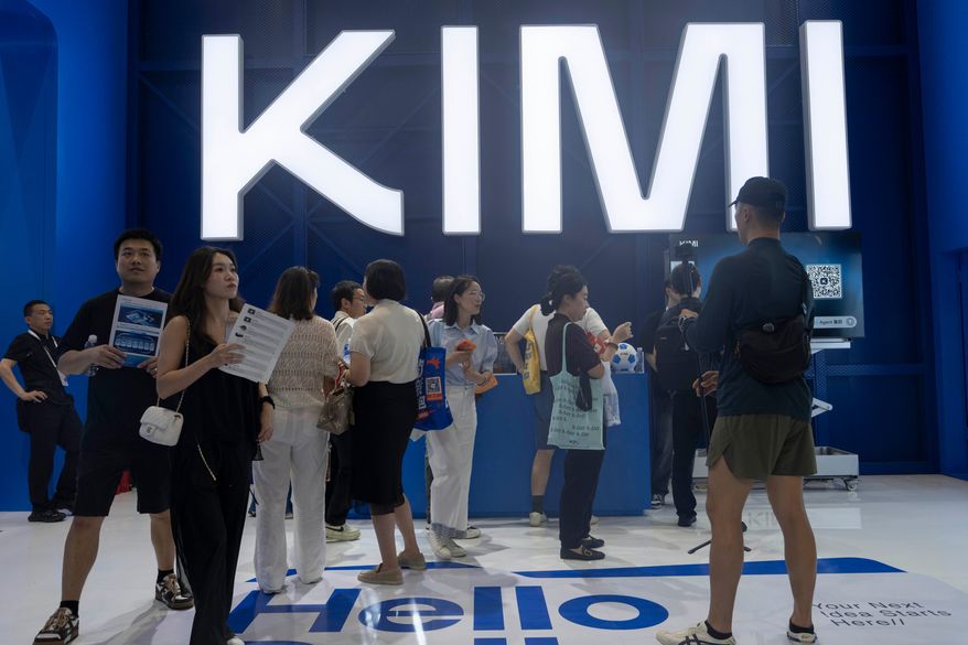 Visitors at the booth for Moonshot's Kimi K3 during the World Artificial Intelligence Conference in Shanghai, Friday, July 17, 2026. (AP Photo/Ng Han Guan)