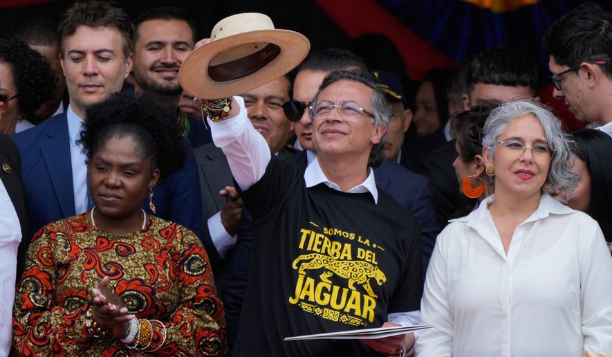 President Gustavo Petro addresses supporters, flanked by Vice President Francia Marquez, left, and Sen. Maria Jose Pizarro, right, after a military parade marking Colombia's Independence Day in Bogota, Colombia, Monday, July 20, 2026. (AP Photo/Fernando Vergara)