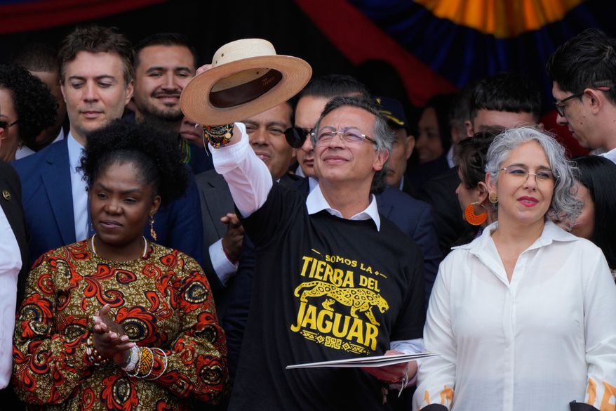 President Gustavo Petro addresses supporters, flanked by Vice President Francia Marquez, left, and Sen. Maria Jose Pizarro, right, after a military parade marking Colombia's Independence Day in Bogota, Colombia, Monday, July 20, 2026. (AP Photo/Fernando Vergara)