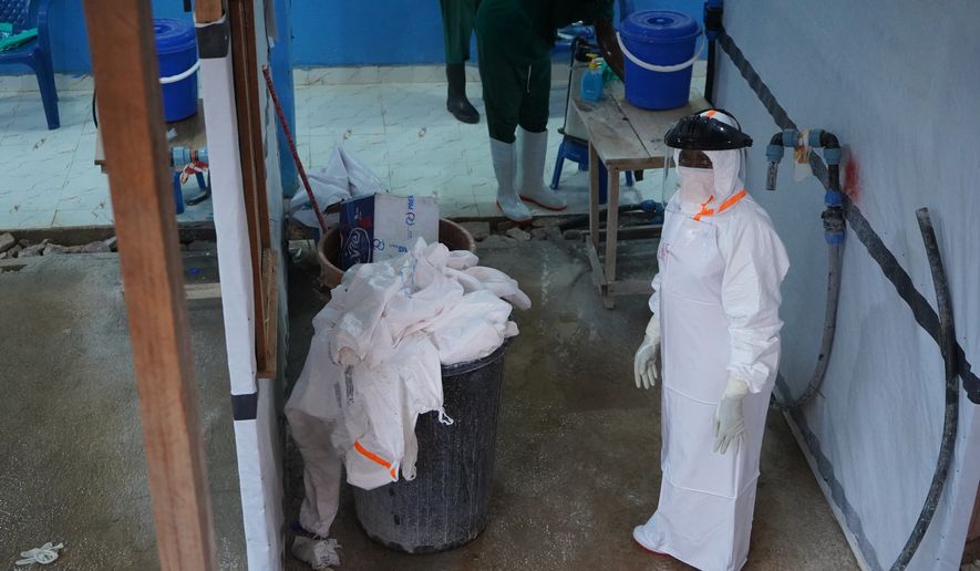 A health worker stands at an ebola treatment centre in Bunia, Congo, Monday, July 20, 2026. (AP Photo/Prosper Heri Ngorora)