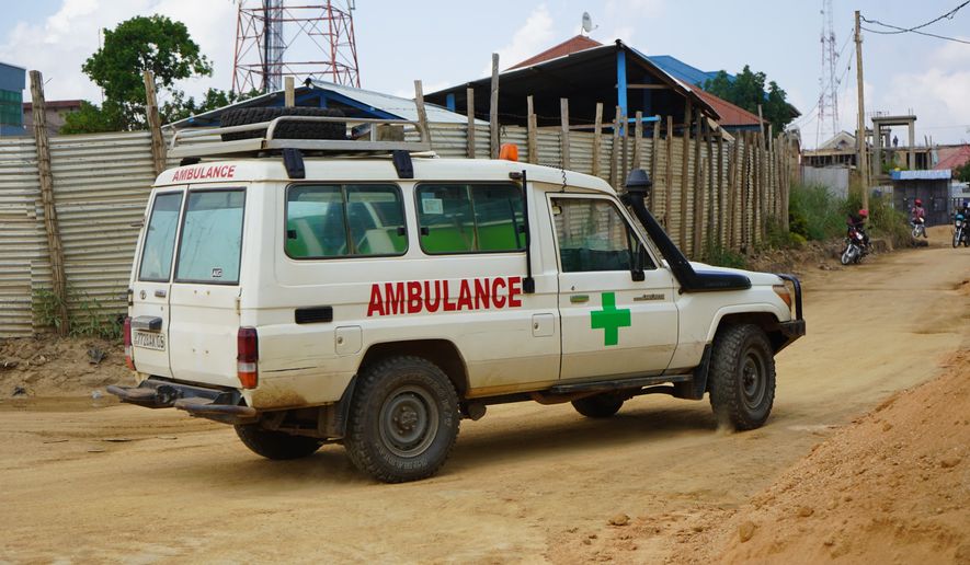 An ambulance drives past an ebola treatment centre in Bunia, Congo, Monday, July 20, 2026. (AP Photo/Prosper Heri Ngorora)