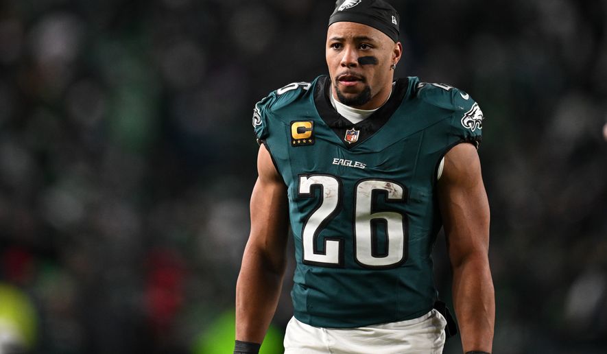 FILE - Philadelphia Eagles running back Saquon Barkley (26) walks off the field during halftime or an NFL wild card playoff football game against the San Francisco 49ers, Sunday, Jan. 11, 2026, in Philadelphia. (AP Photo/Terrance Williams, File)