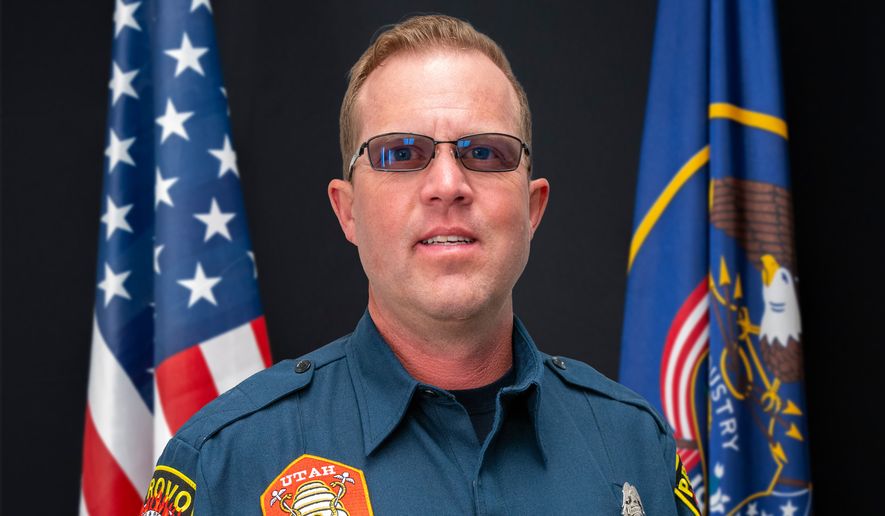 This photo provided by Provo Fire & Rescue, Monday, July 20, 2026, shows Provo Fire Department Capt. Spencer Long posing for an official portrait at the Provo City Hall in Provo, Utah, April 10, 2024. (Brett Borget/Provo Fire & Rescue via AP)