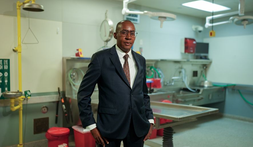 Los Angeles County medical examiner, Dr. Odey Ukpo, poses for a portrait on Tuesday, June 16, 2026, in Los Angeles. (AP Photo/Jae C. Hong)