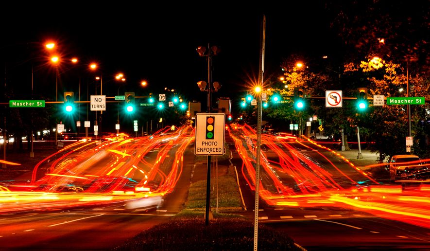 FILE - This long exposure photo shows traffic driving on Roosevelt Boulevard in Philadelphia, May 25, 2022. (AP Photo/Matt Rourke, File)
