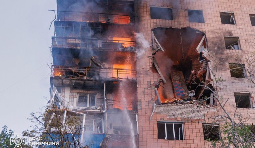 In this photo provided by the Ukrainian Emergency Service, a residential building is seen in fire following a Russian air attack in Kramatorsk, Donetsk region, Ukraine, Monday, July 20, 2026. (Ukrainian Emergency Service via AP)