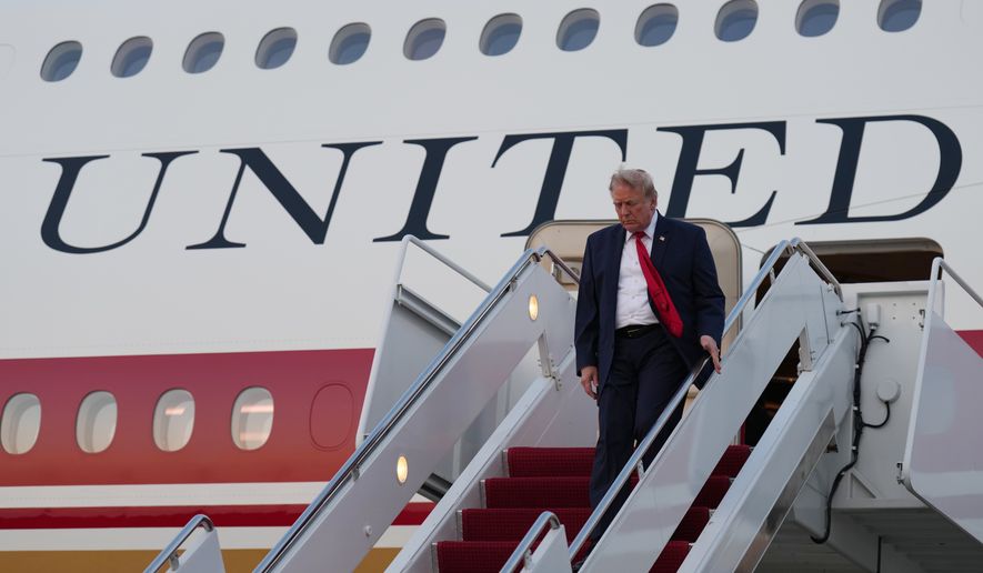 President Donald Trump exits Air Force One at Joint Base Andrews, Md., after attending the World Cup final soccer match, Sunday, July 19, 2026. (AP Photo/Jacquelyn Martin)