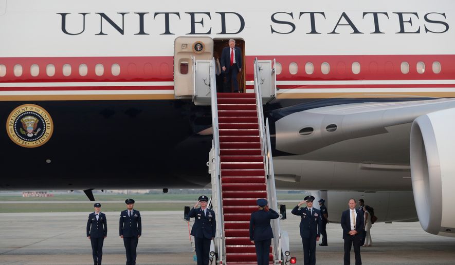 President Donald Trump walks down the stairs of Air Force One upon his arrival at Joint Base Andrews, Md., Sunday, July 19, 2026. (AP Photo/Luis M. Alvarez)