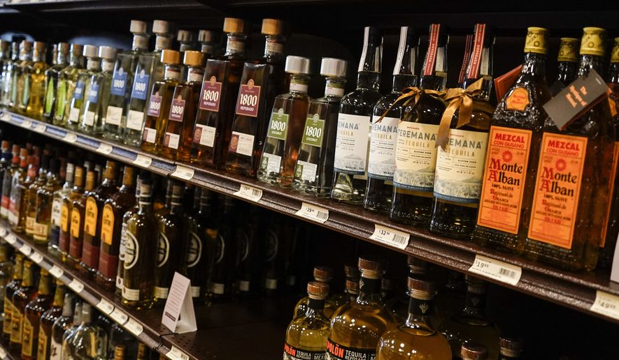 Shelves display bottles of tequila for sale at a Pennsylvania fine wine and spirits store, Saturday, Jan. 22, 2022, in Harmony, Pa. (AP Photo/Keith Srakocic)