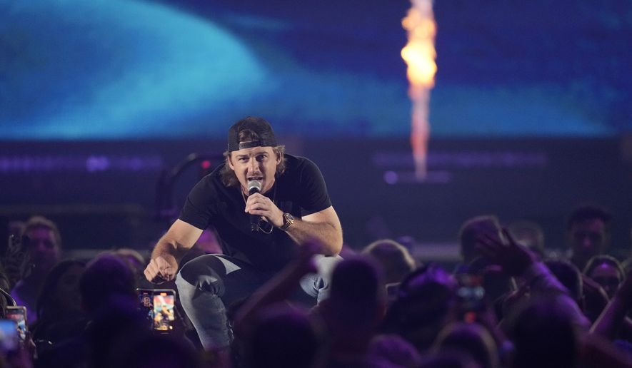 Morgan Wallen performs with Diplo on the first night of the 2022 iHeartRadio Music Festival, Friday, Sept. 23, 2022, in Las Vegas. (AP Photo/John Locher)