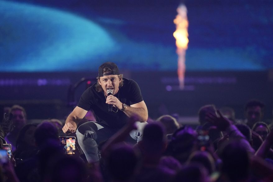 Morgan Wallen performs with Diplo on the first night of the 2022 iHeartRadio Music Festival, Friday, Sept. 23, 2022, in Las Vegas. (AP Photo/John Locher)