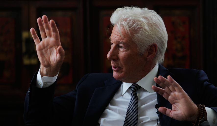 Richard Gere answers to questions during a meeting with media in Berlin, Germany, Thursday, June 4, 2026, on the sidelines of the launch of a joint initiative on migration by the Hertie School Centre for Fundamental Rights and The Gere Foundation. (AP Photo/Markus Schreiber)