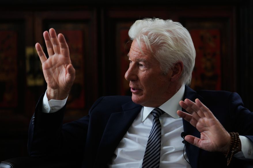 Richard Gere answers to questions during a meeting with media in Berlin, Germany, Thursday, June 4, 2026, on the sidelines of the launch of a joint initiative on migration by the Hertie School Centre for Fundamental Rights and The Gere Foundation. (AP Photo/Markus Schreiber)