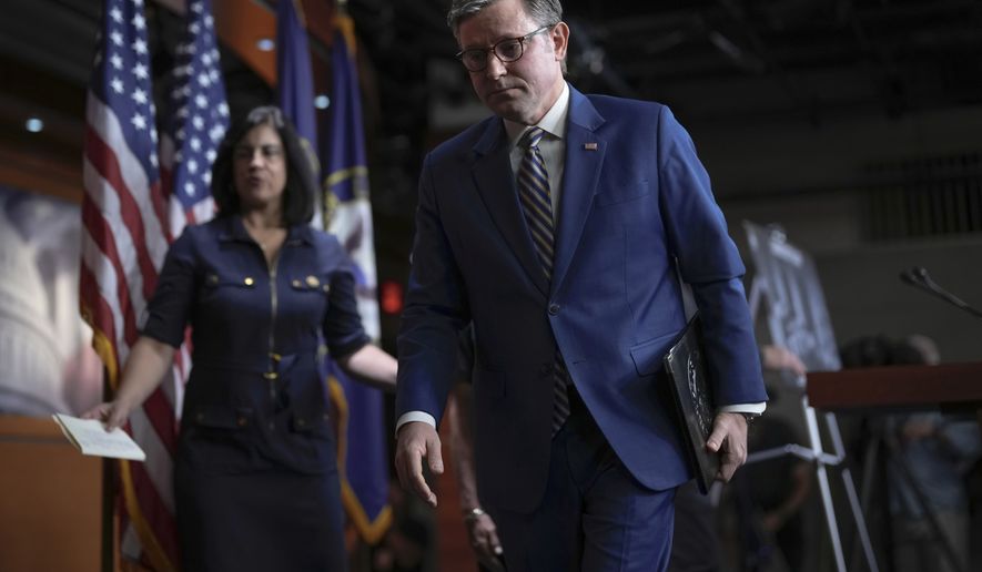 Speaker of the House Mike Johnson, R-La., and GOP leaders depart after meeting with reporters as he tries to advance a spending package for the Iran war, farm aid and President Donald Trump's push for strict new voter ID requirements, at the Capitol in Washington, Tuesday, July 21, 2026. (AP Photo/J. Scott Applewhite)