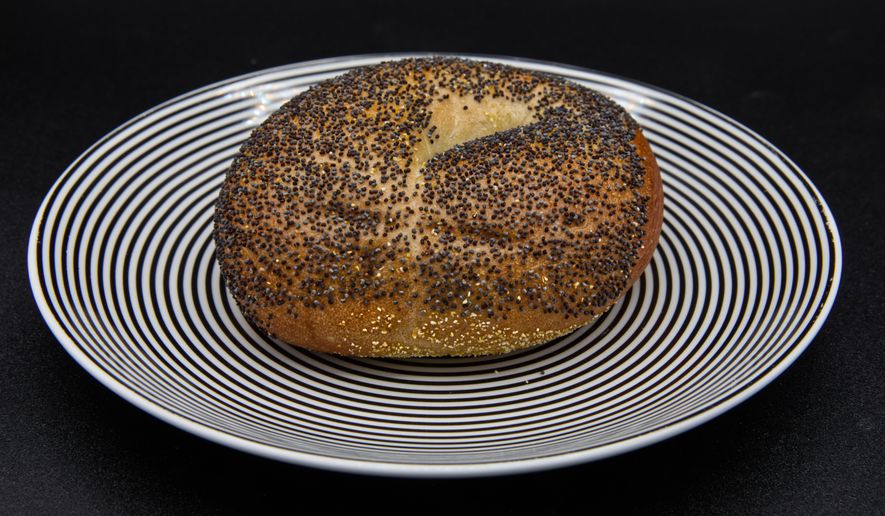 A poppy seed bagel on a plate photographed in Phoenix, Ariz., Monday, July 20, 2026. (AP Photo/Dario Lopez-Mills)