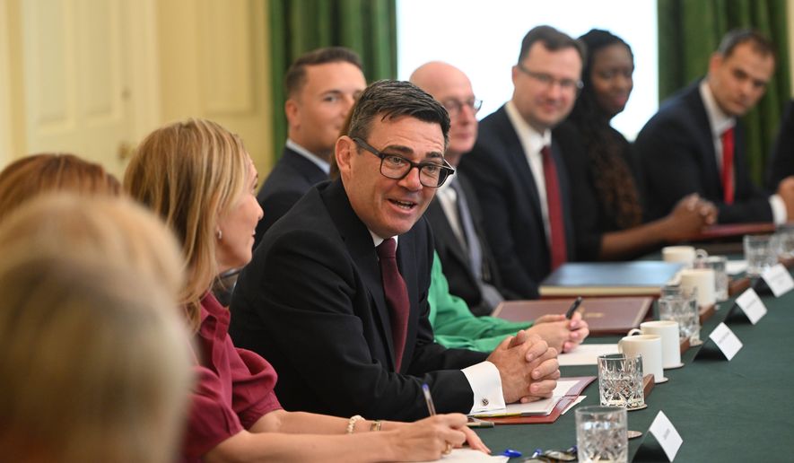 Britain's Prime Minister Andy Burnham, center, attends his first cabinet meeting as prime minister at 10 Downing Street, London, Tuesday July 21, 2026. (Eddie Mulholland/Pool Photo via AP)