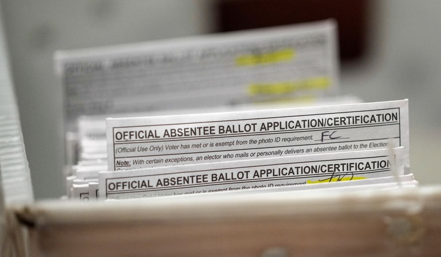 FILE - Absentee ballots during a count at the Wisconsin Center, Nov. 8, 2022, in Milwaukee. (AP Photo/Morry Gash, File)
