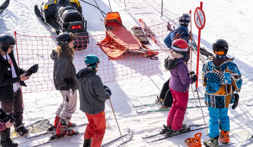 A group of skiers gather on the slopes at Afriski Mountain Resort in Maluti, Lesotho, Saturday, July 11, 2026. (AP Photo/Kayleen Morgan)