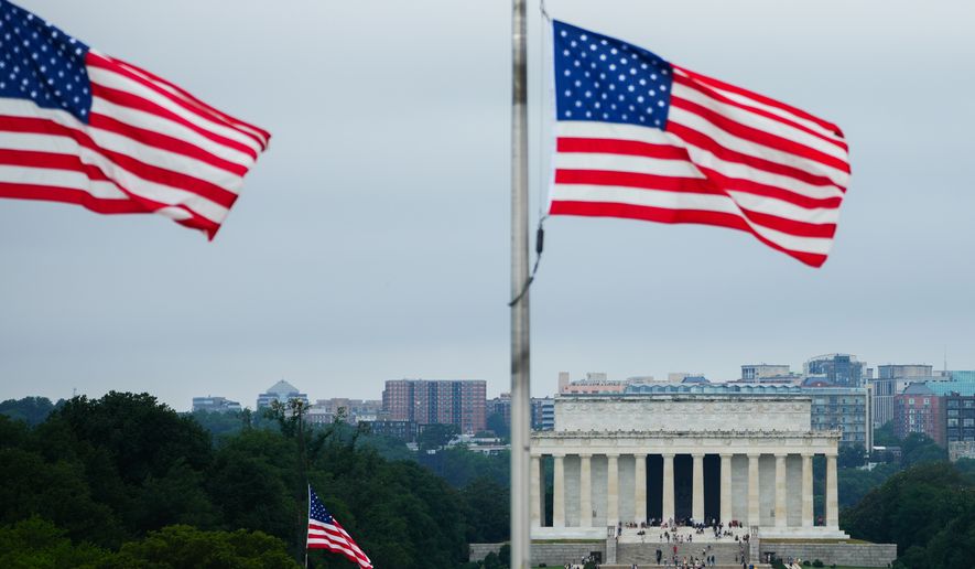 American flags fly above the Lincoln Memorial, Thursday, July 9, 2026, in Washington. (AP Photo/Julia Demaree Nikhinson)