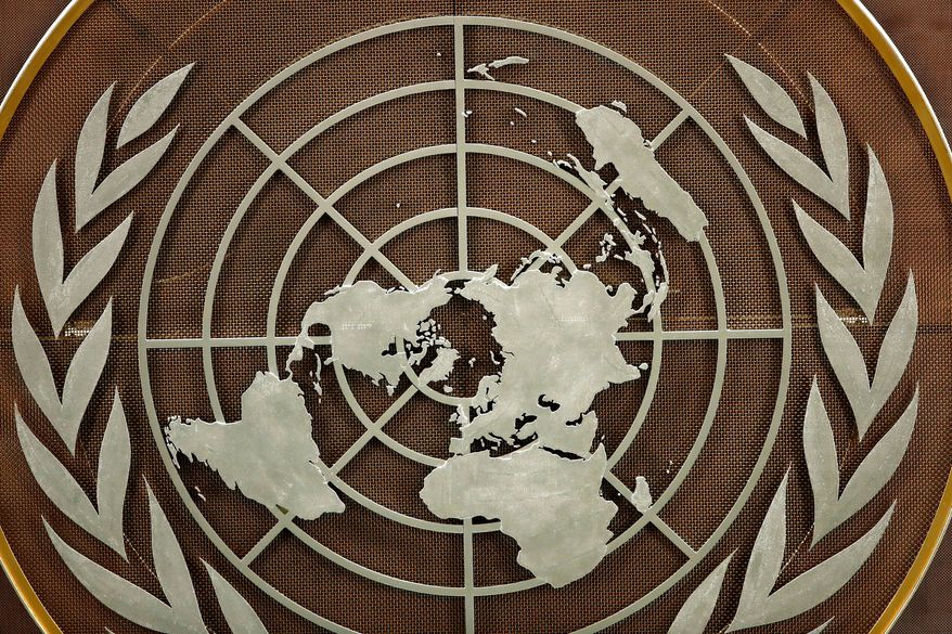 FILE - The United Nations logo is seen at the General Assembly hall at U.N. headquarters, Sept. 21, 2021. (Eduardo Munoz/Pool Photo via AP, file)