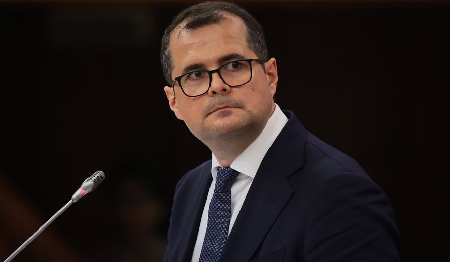 Prime Minister designate Vasile Tofan speaks before the parliament's confidence vote for the new government team in Chisinau, Moldova, Tuesday, July 21, 2026. (AP Photo/Aurel Obreja)