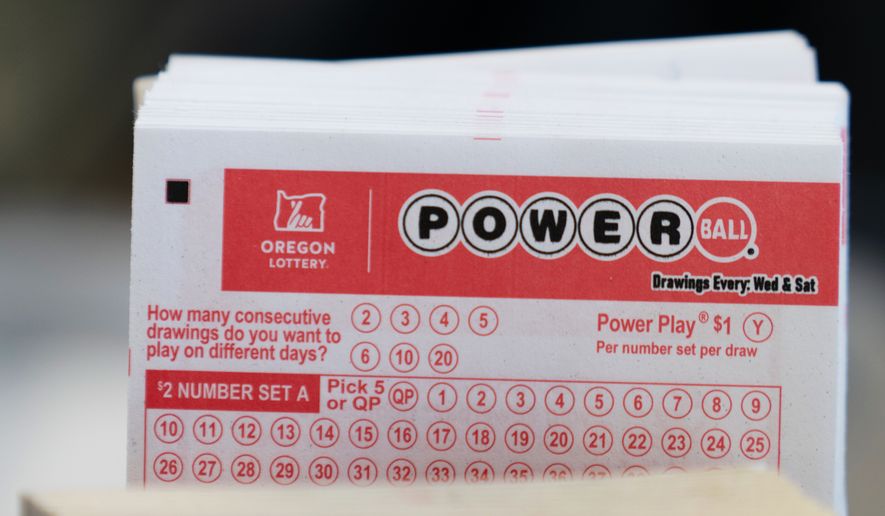 Powerball lottery tickets are sold at a convenience store, Dec. 22, 2025, in Portland, Ore. (AP Photo/Jenny Kane, File)