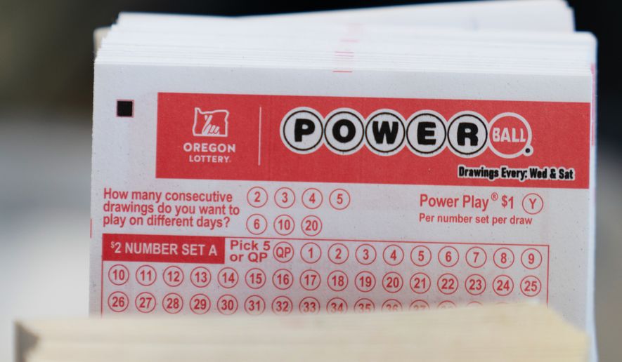 Powerball lottery tickets are sold at a convenience store, Dec. 22, 2025, in Portland, Ore. (AP Photo/Jenny Kane, File)