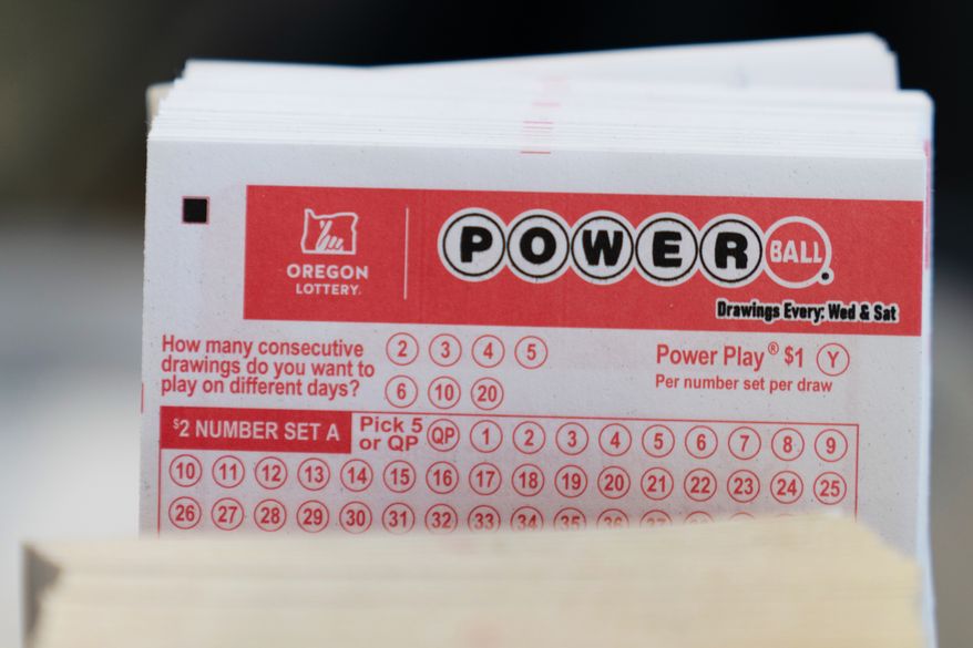Powerball lottery tickets are sold at a convenience store, Dec. 22, 2025, in Portland, Ore. (AP Photo/Jenny Kane, File)