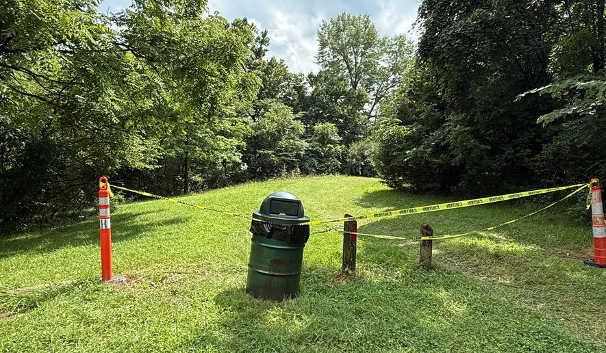 A section of the Riverside Dr Scioto Fishing Area is sectioned off on Tuesday, July 21, 2026, in Powell, Ohio. (AP Photo/Patrick Aftoora-Orsagos)