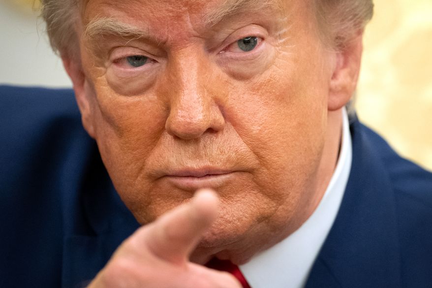 President Donald Trump gestures while meeting with Lebanese President Joseph Aoun in the Oval Office at the White House, Tuesday, July 21, 2026, in Washington. (AP Photo/Mark Schiefelbein)