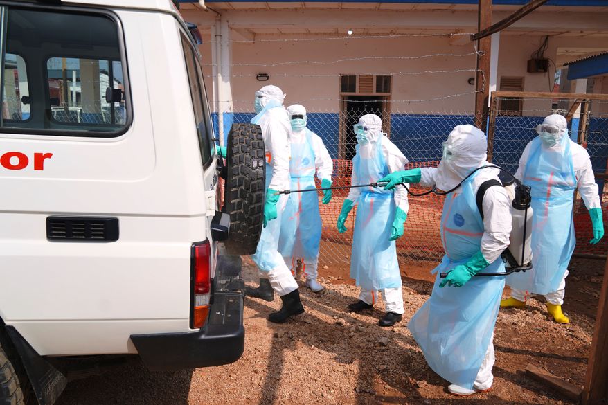 Health workers disinfects an ambulance at Ebola Treatment Center at Bunia General Hospital in Ituri, Congo, Wednesday, July 22, 2026. (AP Photo/Dirole Lotsima Dieudonne) ** FILE **
