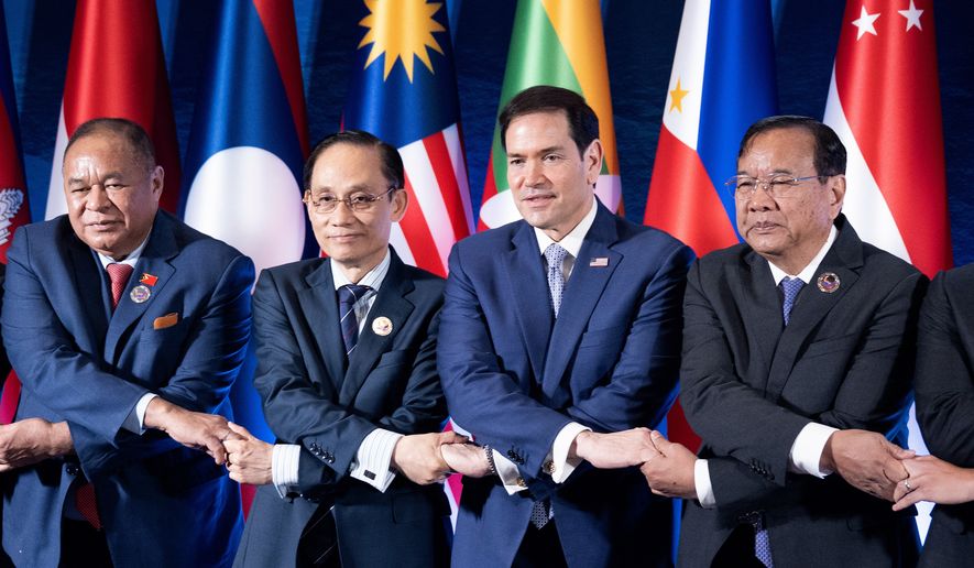 From left, East Timor's Foreign Minister Bendito dos Santos Freitas, Vietnam Foreign Minister Le Hoai Trung, U.S. Secretary of State Marco Rubio and Cambodia's Foreign Minister Prak Sokhonn join hands during the ASEAN Post-Ministerial Conference with the United States on the sidelines of the Association of Southeast Asian Nations (ASEAN) Foreign Ministers' Meeting in Pasay city, Metro Manila, Philippines Wednesday, July 22, 2026. (Brendan Smialowski/Pool Photo via AP)