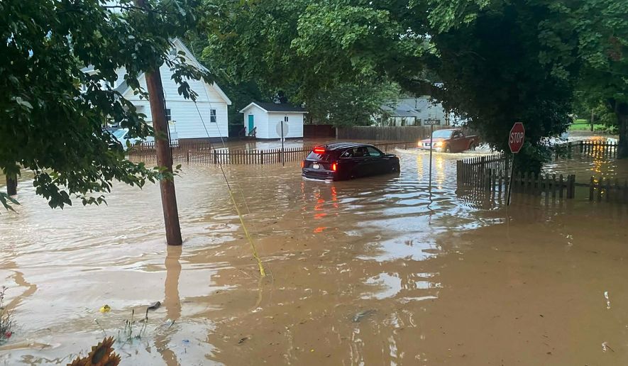 This photo provided by Joe Kinzer shows flash flooding Tuesday, July 21, 2026, in Buckhannon, W.Va. (Joe Kinzer via AP)