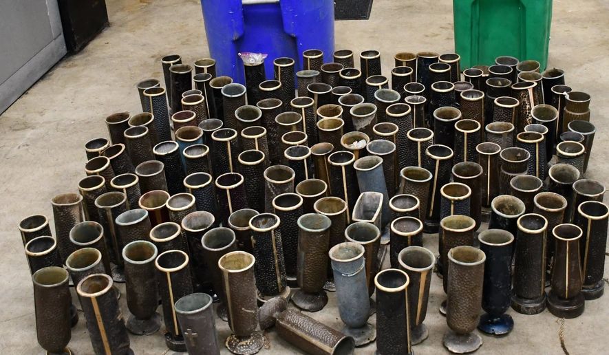 The Charles County Sheriff’s Office has arrested two men accused of taking over 100 bronze vases from a cemetery so they could be melted down. The 100 memorial vases, worth a total of more than $100,000, were taken at separate times from Trinity Memorial Gardens in Waldorf last month and earlier this month. On July 8, deputies noticed a van near the cemetery and upon following up found vases in trash cans, the sheriff’s office said on social media. (Photo courtesy of Charles County Sheriff's Office)