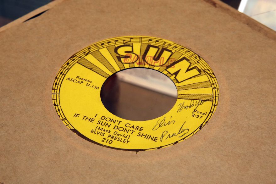 A 1954 Elvis Presley signed Sun Records 45rpm record of "I Don't Care If The Sun Don't Shine," estimated at $9,000 to $12,000, is displayed at Gotta Have It! Collectibles, in New York, Wednesday, July 19, 2017. (AP Photo/Richard Drew)