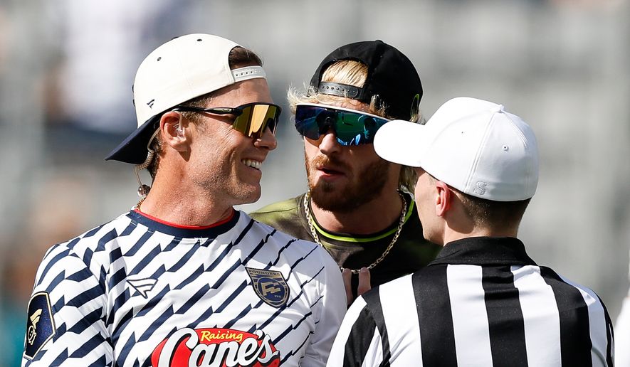 Founders FFC's Tom Brady and Wildcats FFC's Logan Paul talk on the field during the Fanatics Flag Football Classic, Saturday, March 21, 2026, in Los Angeles. (AP Photo/Caroline Brehman)